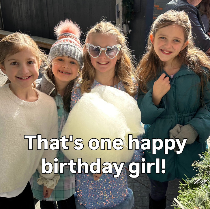 Four girls celebrating a birthday with cotton candy